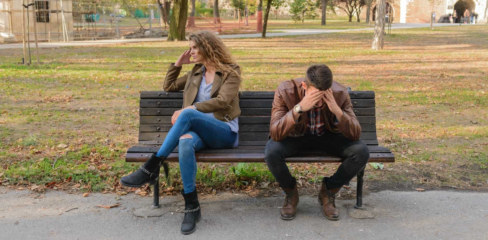 two people on a bench in a frustrated relationship