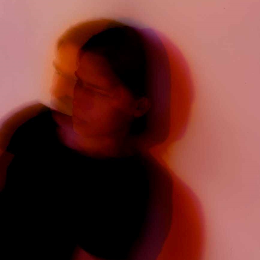 A person with a blurred outline in a counselling session