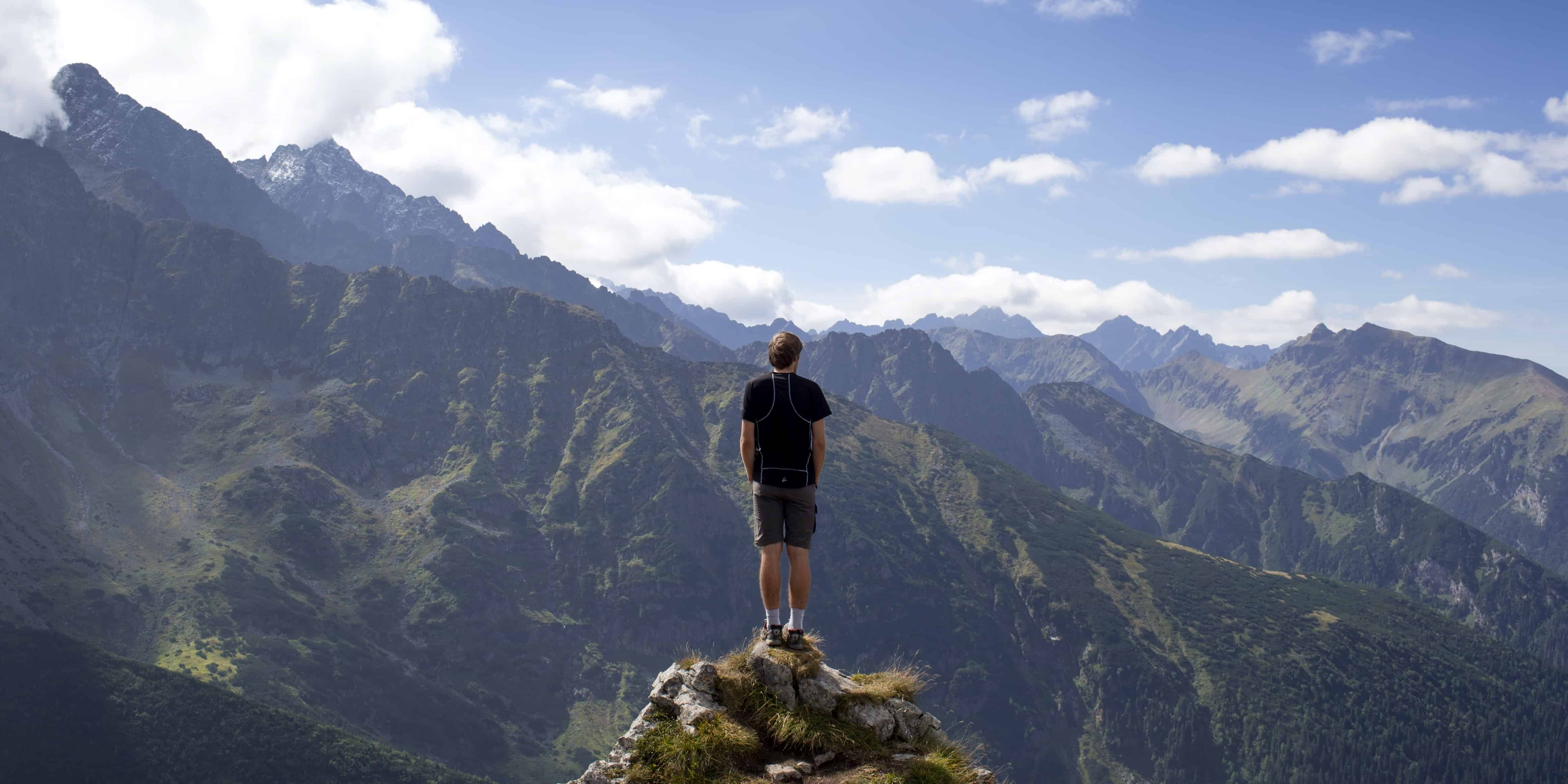 Man in counselling session on top of a mountain